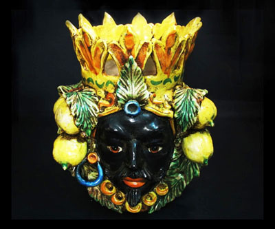 A "Moor's Head" vase from Caltagirone; apparently the Africans in those days liked using fruit as hair grips.