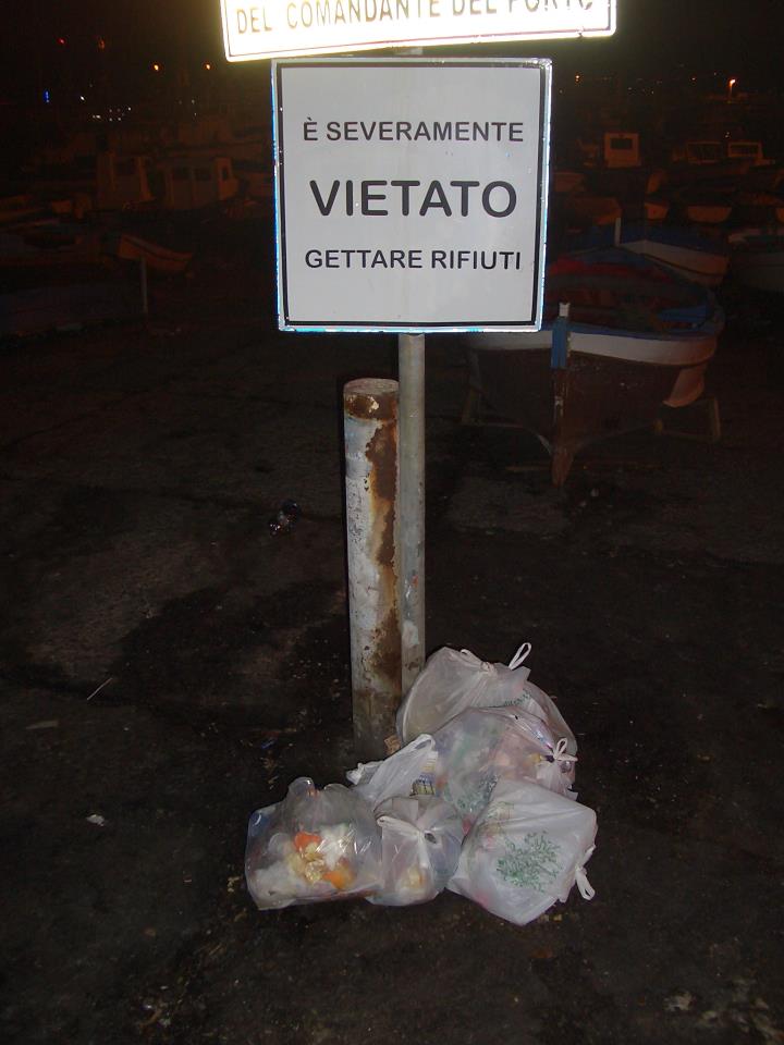 I took this picture recently while taking an evening stroll along the sea front. The sign says "It is STRICTLY forbidden to throw rubbish here." .....Ah, these Sicilians!