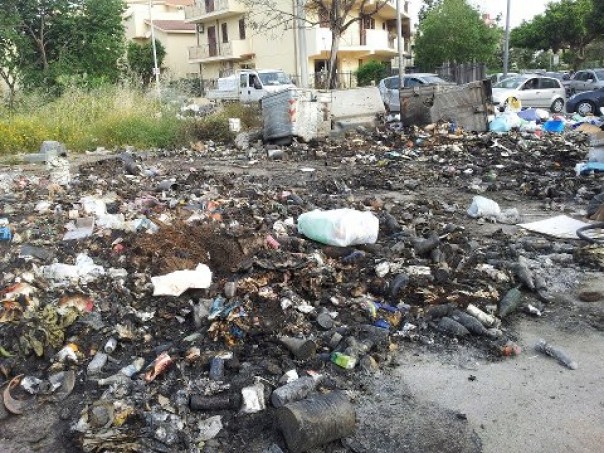 The remains of burnt rubbish. There will be a new mountain of rubbish here by tonight...